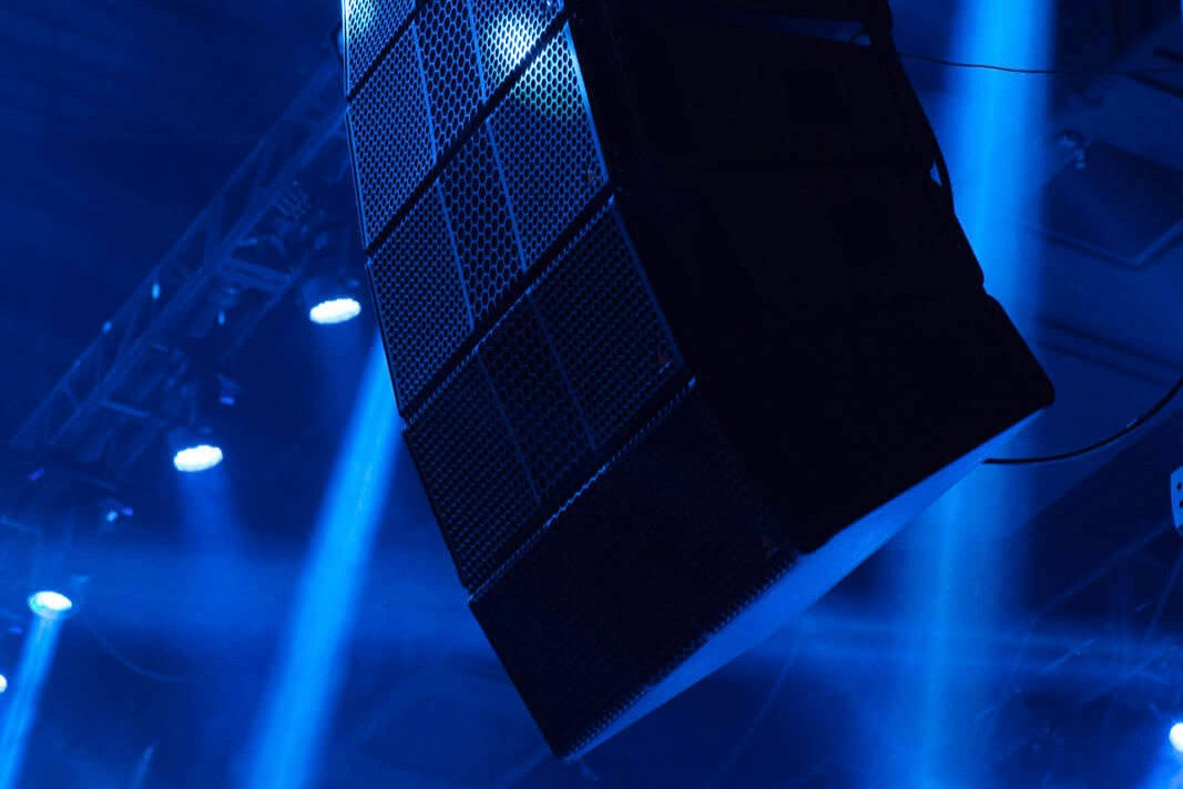 Line array speakers under stage lights